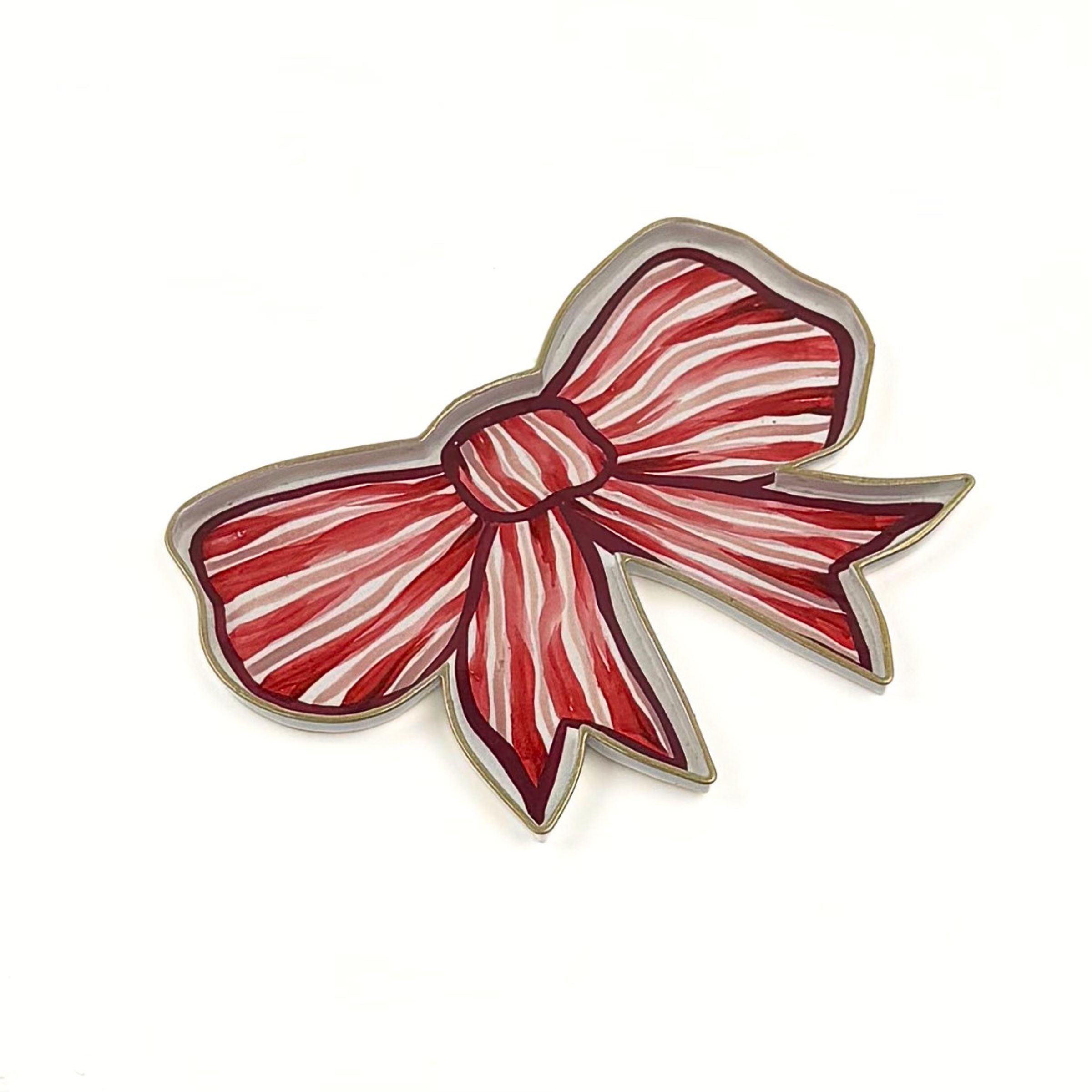 Red and white striped bow-shaped tray with gold edging displayed on a white background.