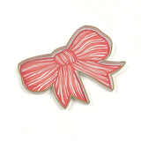 hand-painted tole tray featuring a delicate pink bow with white stripes and elegant gold trim on a white background