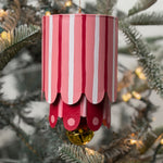 Colorful tole metal lantern Christmas ornaments featuring pink, and stripes with gold bell.