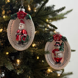 Festive glass Christmas ornaments featuring Santa and snowman designs with sparkling silver, red, and green accents.