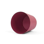 Bright Pink small tole metal cachepot with gold base and trim  showing the inside on a white background
