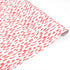 a roll of gift wrap with a pink brushstroke pattern design. 