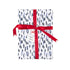 Gift wrapped in blue brushstroke wrapping paper with red ribbon and blue patriotic tag.