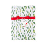 A gift-wrapped package with a white background, irregular green and light yellow brushstrokes, tied with a red ribbon and a Santa-themed tag reading 'To: Santa'.