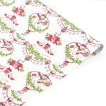 A roll of Christmas
wrapping paper with a repeating pattern of white mice, red bows, green holly, and gift boxes on a white background.