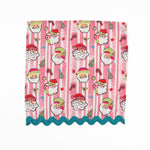 Pink striped Christmas dinner napkins featuring cheerful Santa faces, festive motifs, and turquoise ric rac trim.