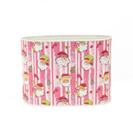 Large Festive Christmas caddy featuring cheerful Santa faces, pink stripes, candy canes, and holiday decorations.