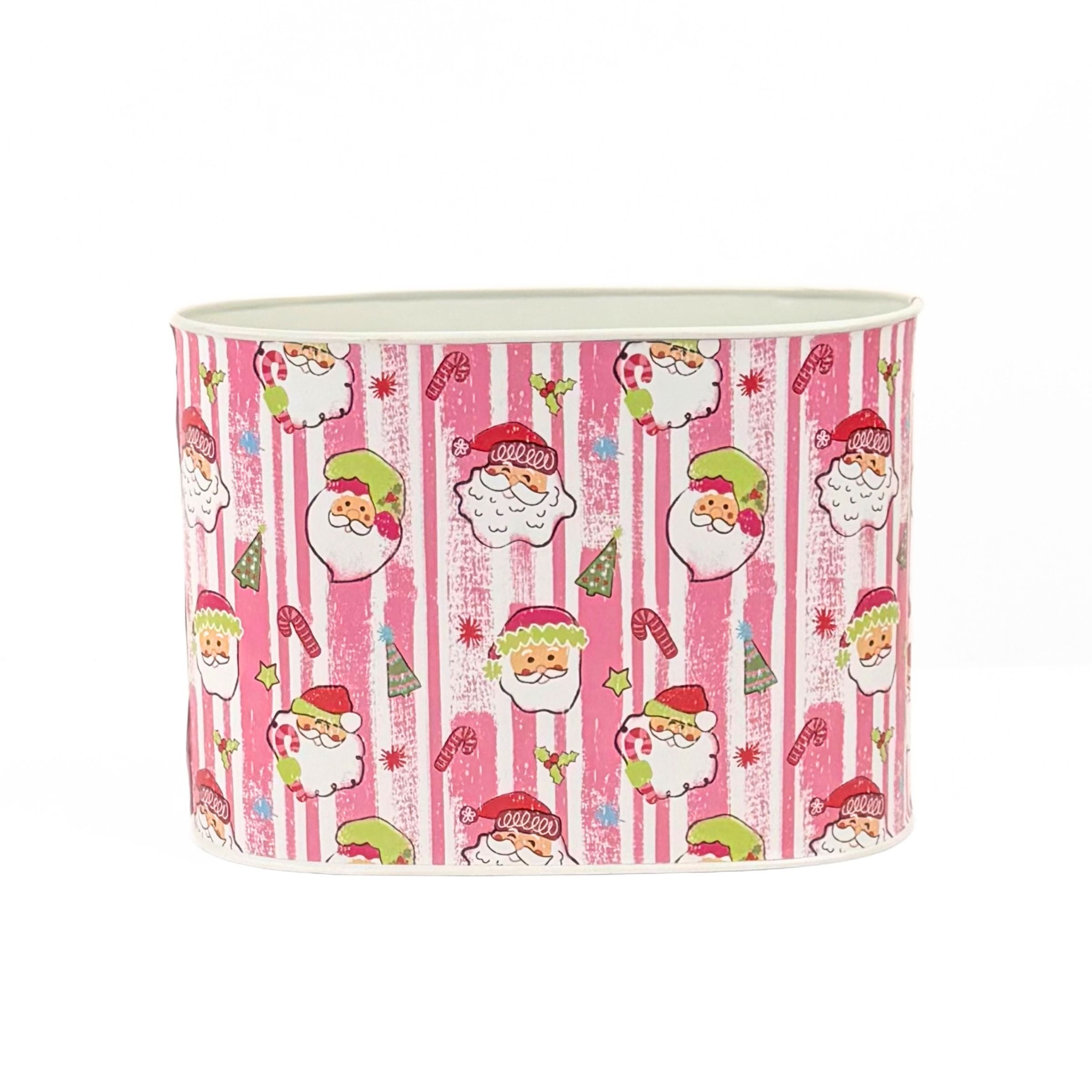 Large Festive Christmas caddy featuring cheerful Santa faces, pink stripes, candy canes, and holiday decorations.