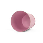 Bright light pink small tole metal cachepot with gold base and trim  showing the inside on a white background