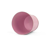 Bright light pink small tole metal cachepot with gold base and trim  showing the inside on a white background