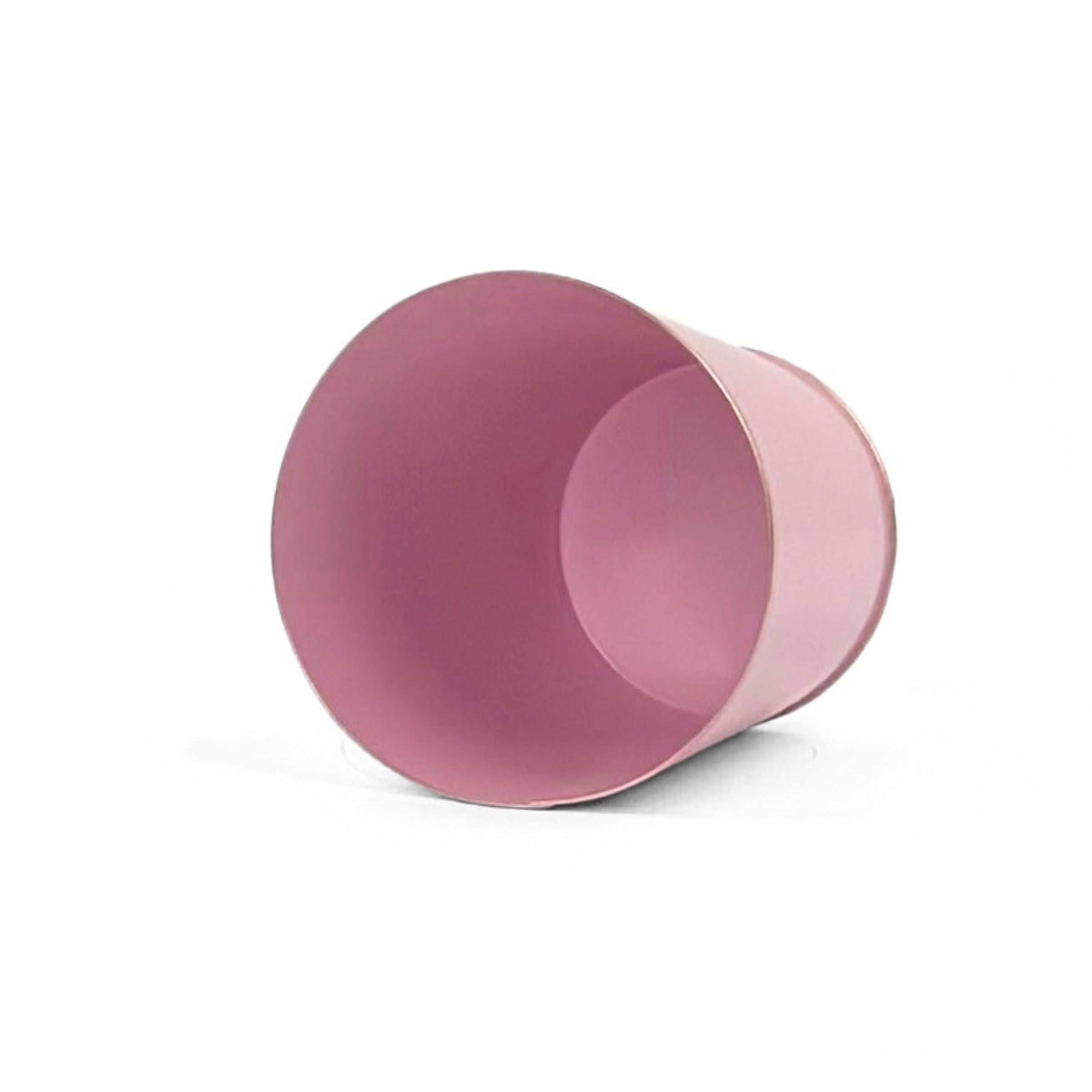 Bright light pink small tole metal cachepot with gold base and trim  showing the inside on a white background
