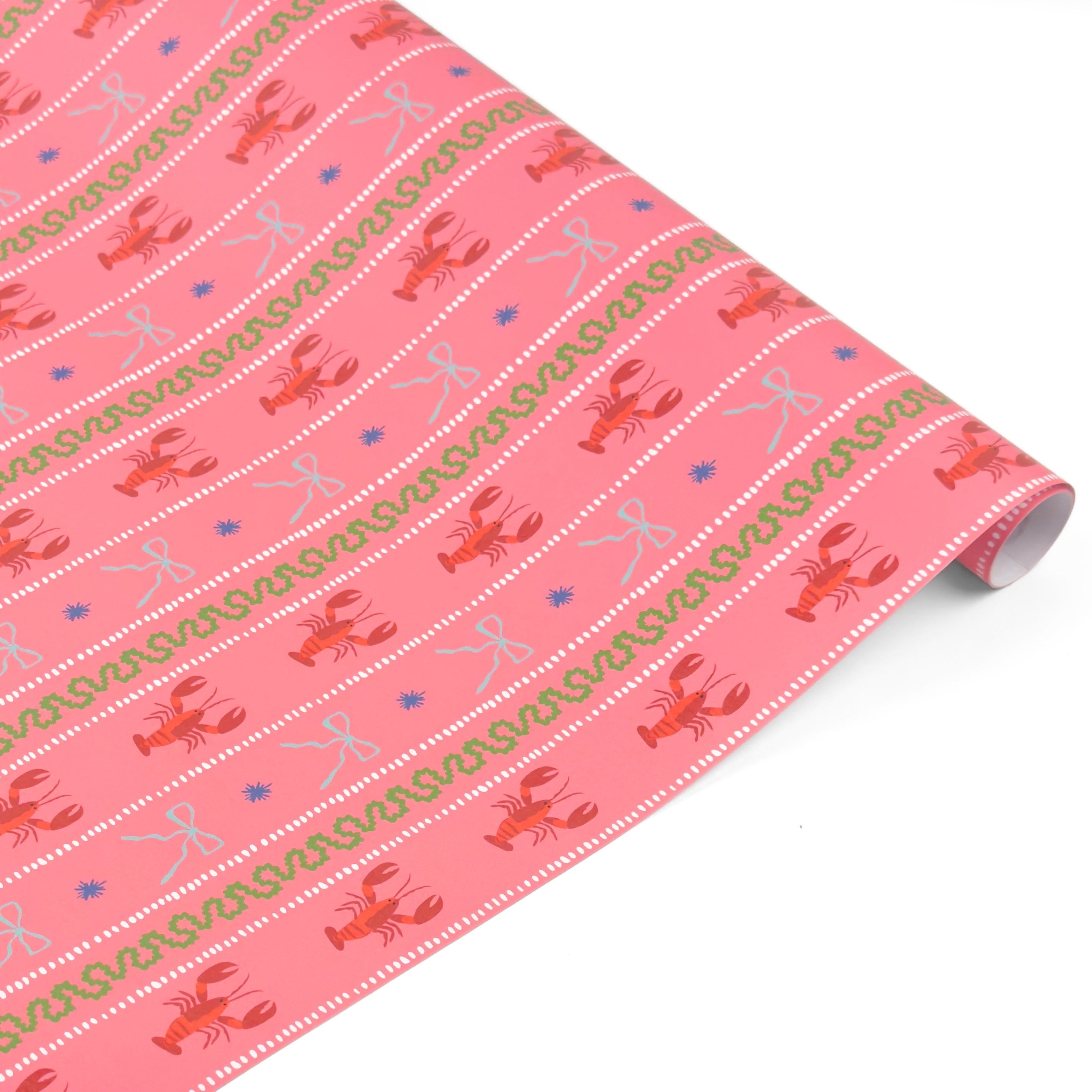 pink gift wrap with lobster, blue bow and green squiddly line motifs