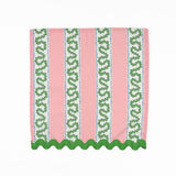 Pink cloth dinner napkins featuring green wavy stripes, blue dotted accents, and green scalloped trim.
