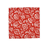 Red cloth dinner napkins featuring intricate white block print floral patterns for elegant table settings.