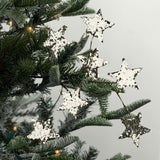 Silver spray of stars featuring sparkling glitter accents, perfect for festive Christmas trees and arrangements.