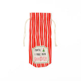 red and white striped wine bag with a “Santa, I have been goodish” label on the front