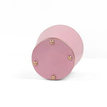 A bright Light pink large tole metal cachepot bottom with four small gold-tone studs, shown on a white background.