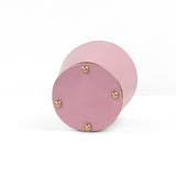 A bright Light pink large tole metal cachepot bottom with four small gold-tone studs, shown on a white background.
