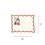 Elegant white cocktail napkins featuring red scalloped borders, colorful Christmas ornaments, holly, and festive embroidery with dimensions of 7" by 9"