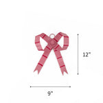 Small pink bow Christmas ornament featuring red stripes, measuring 12" by 9"