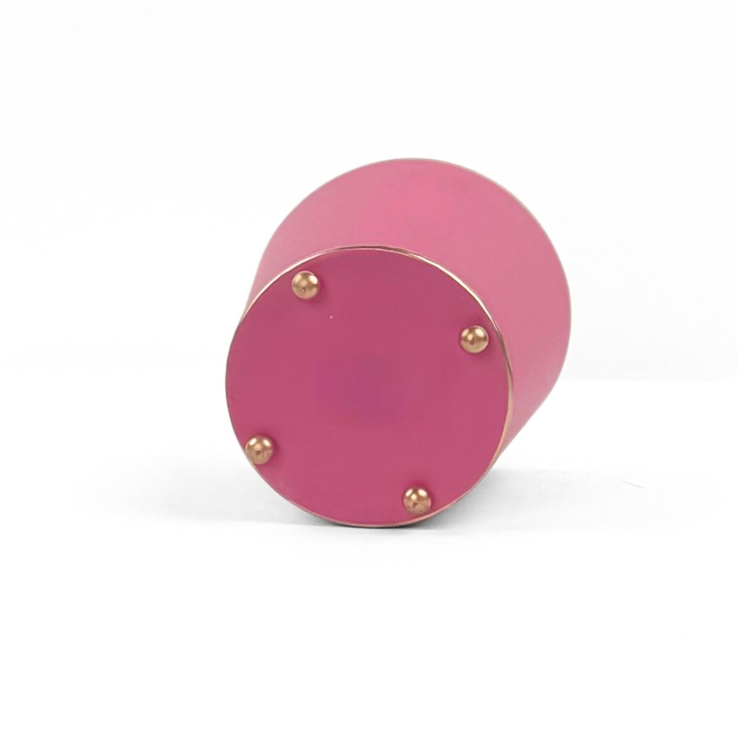 A bright pink large tole metal cachepot bottom with four small gold-tone studs, shown on a white background.