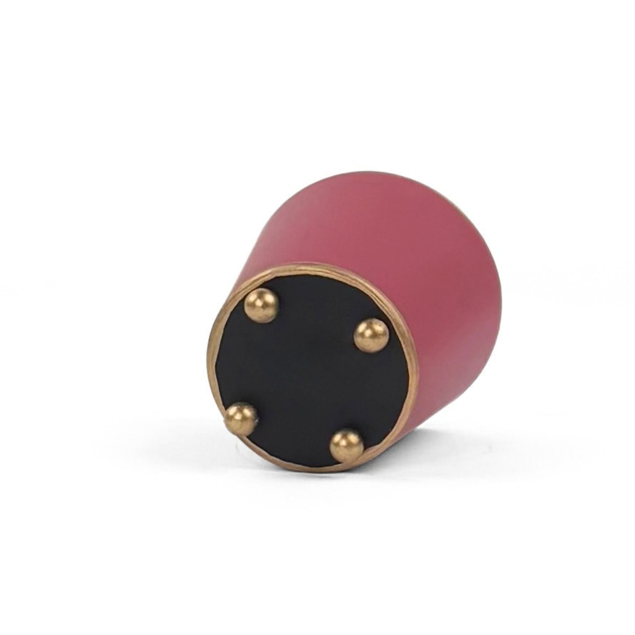 A bright pink small tole metal cachepot bottom with four small gold-tone studs, shown on a white background.