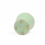 A bright Light green large tole metal cachepot bottom with four small gold-tone studs, shown on a white background.