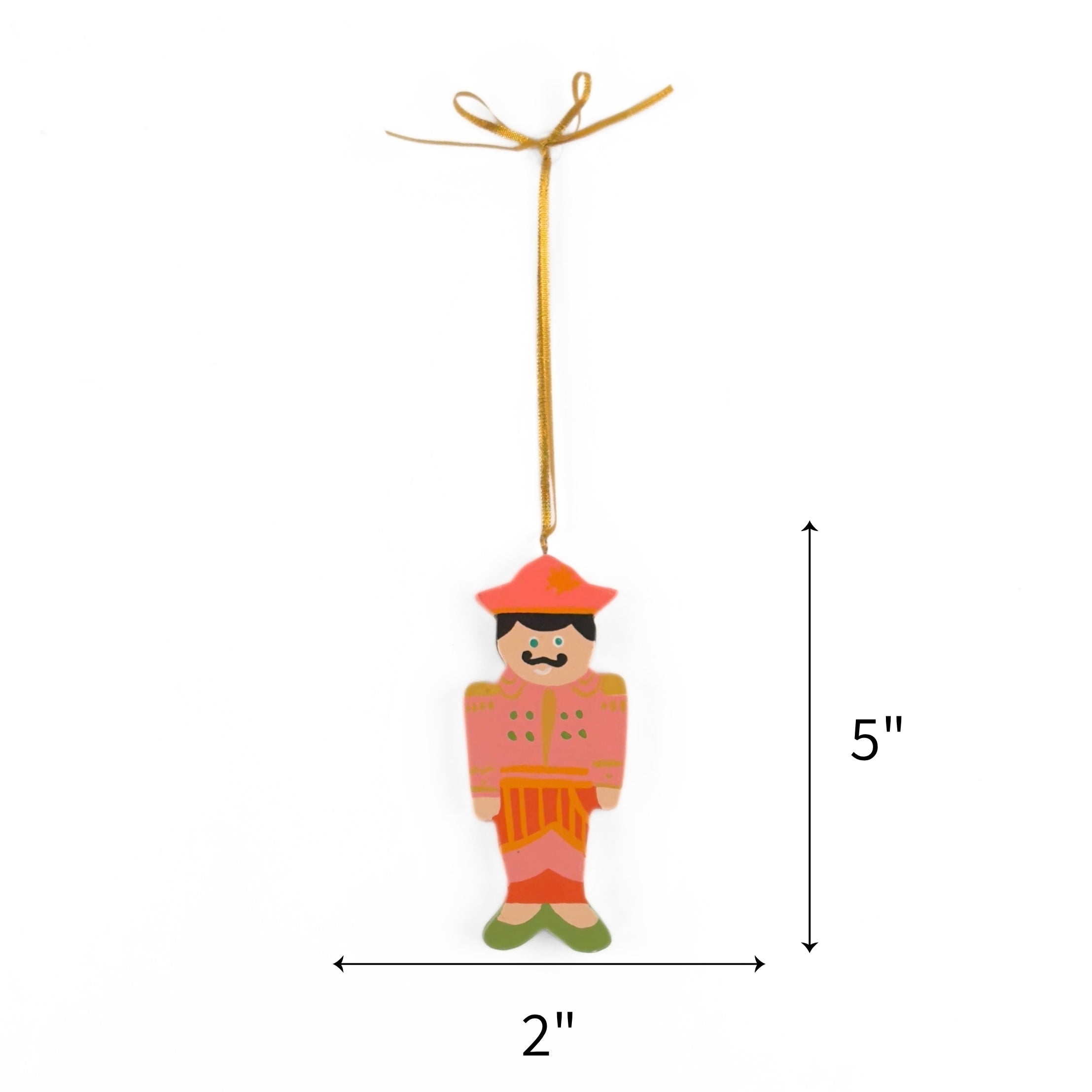 Pink hand painted wooden nutcracker Christmas ornament on a white background with dimension arrows indicating 5" by 2"