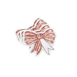 Three Elegant red bow place cards featuring delicate white stripes and personalized names for festive table settings.