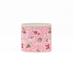 Small Festive pink Christmas caddy featuring nutcrackers, swans, Christmas trees, gifts, and whimsical ribbon patterns