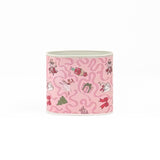 Small Festive pink Christmas caddy featuring nutcrackers, swans, Christmas trees, gifts, and whimsical ribbon patterns