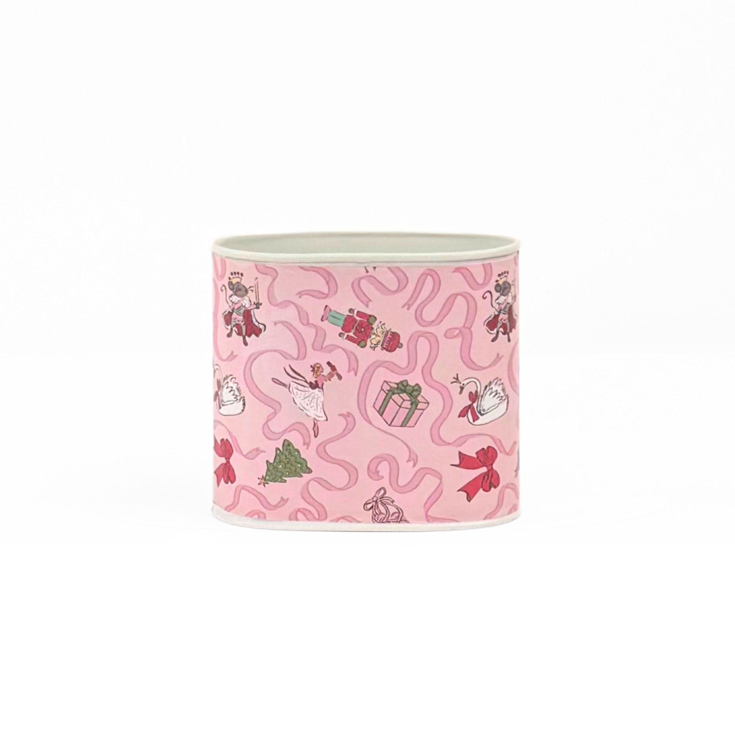 Small Festive pink Christmas caddy featuring nutcrackers, swans, Christmas trees, gifts, and whimsical ribbon patterns