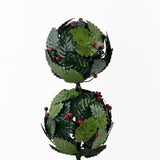 a close up of  tole metal three tiered holly topiary ball centerpiece with glossy leaves in two shades of green and small berry accents throughout. 