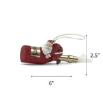 Red glitter champagne bottle ornament with Santa figure clinging to it shown with 6" x 2.5"