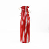back of red and white striped wine bag with a “Santa, I have been goodish” label on the front
