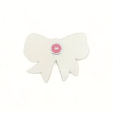 Back view of a bow-shaped tray showing the plain finish and maker label.