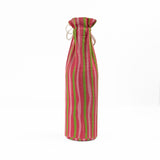 back of pink and green striped wine bag with “Let’s get jolly!” printed on the front