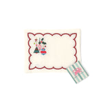 Elegant white cocktail napkins featuring red scalloped borders, colorful Christmas ornaments, holly, and festive embroidery.