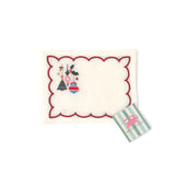 Elegant white cocktail napkins featuring red scalloped borders, colorful Christmas ornaments, holly, and festive embroidery.