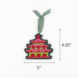 Felt chinoiserie pagoda Christmas ornament featuring pink, red, and green details, measuring 4.25" by 5"