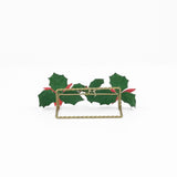 the reverse side of a metal christmas place card holder decorated with red poinsettia flowers and holly leaves 