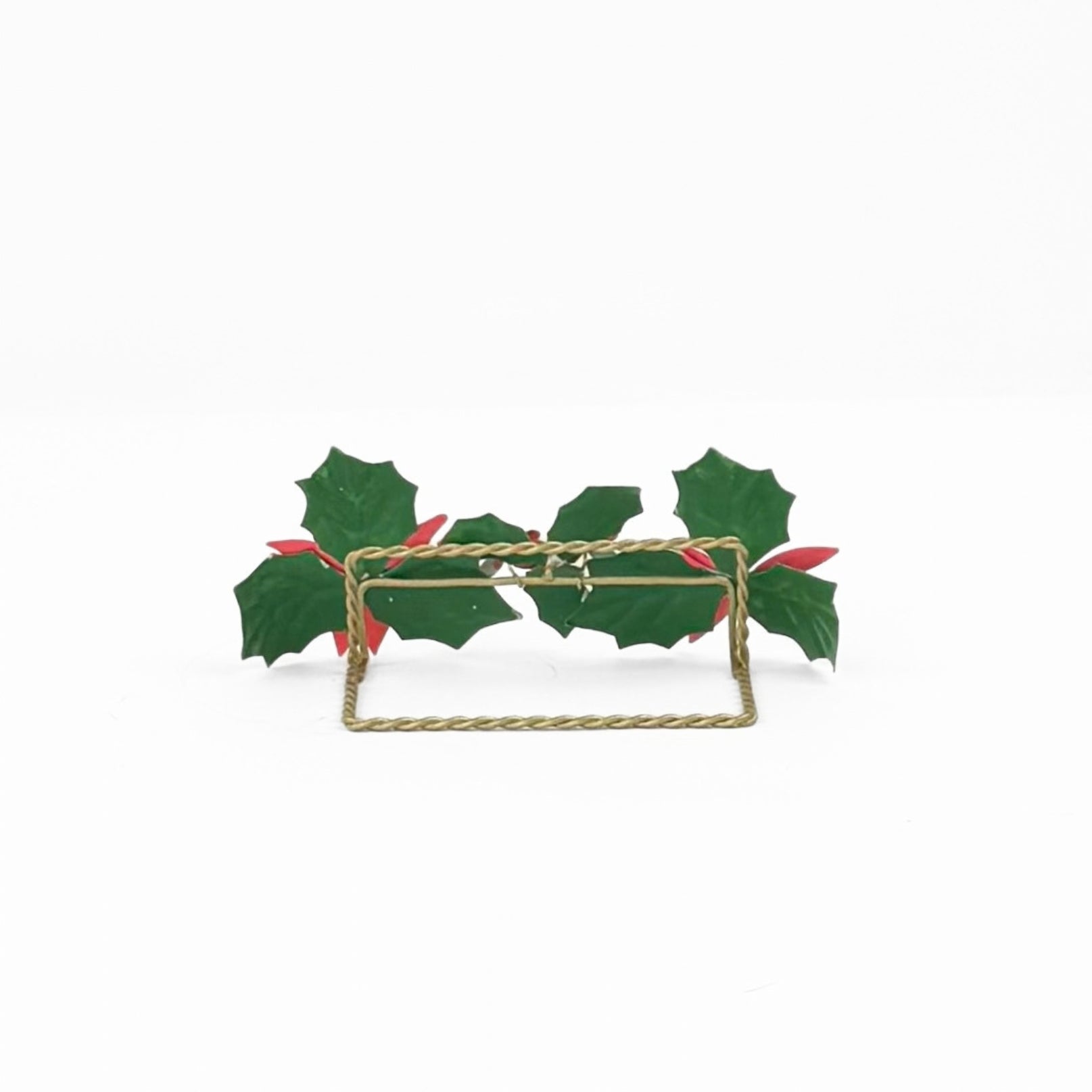 the reverse side of a metal christmas place card holder decorated with red poinsettia flowers and holly leaves 