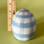blue gingham decorative easter egg with ruler to illustrate scale