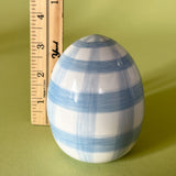 blue gingham decorative easter egg with ruler to illustrate scale