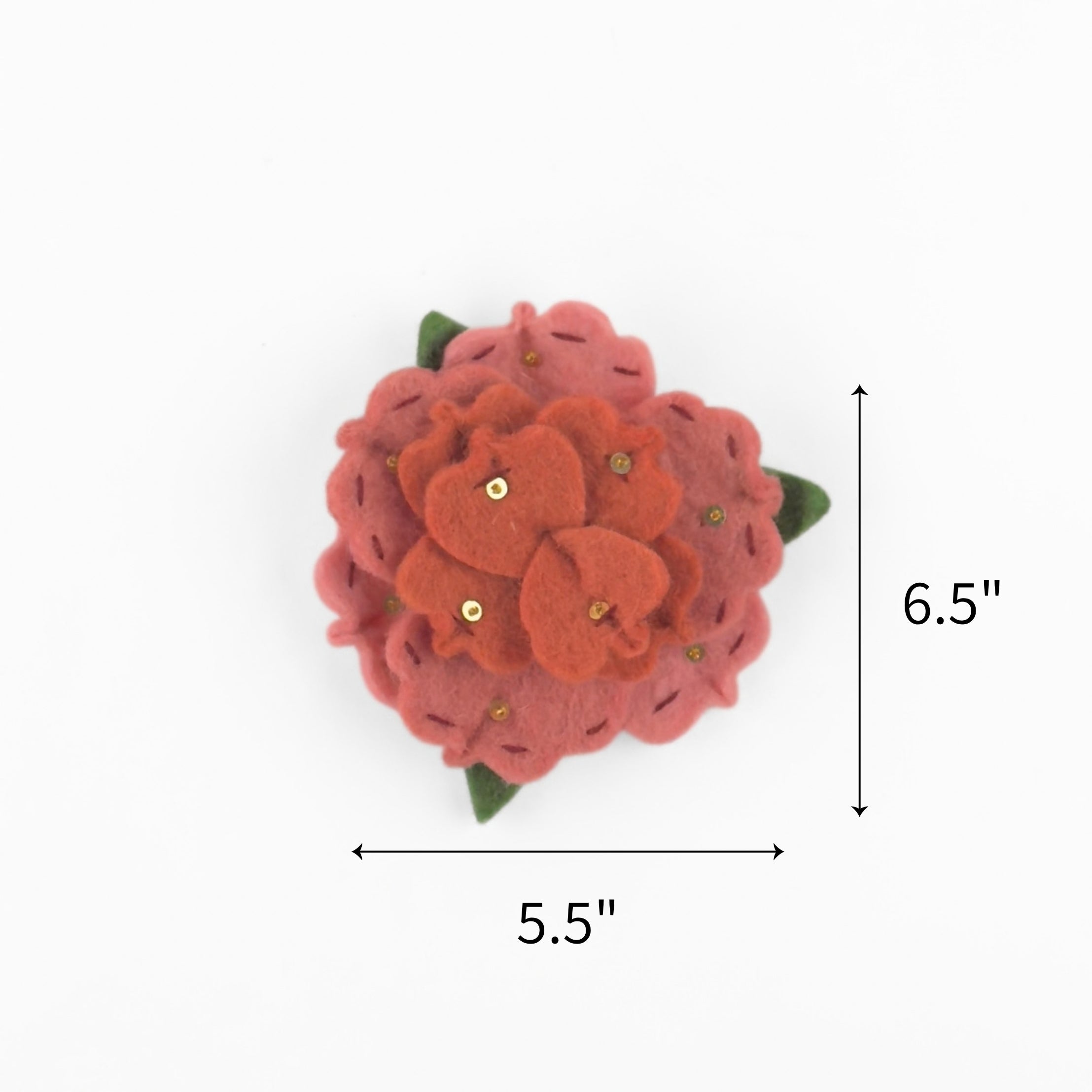Pink felt flower ornament featuring layered petals, green leaves, and gold sequins, measuring 6.5" by 5.5"
