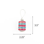 Patriotic tinsel glass ornament featuring shimmering red and blue stripes, measuring 3.5" by 2.25"