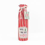 red and white striped wine bag with a “Santa, I have been goodish” label on the front