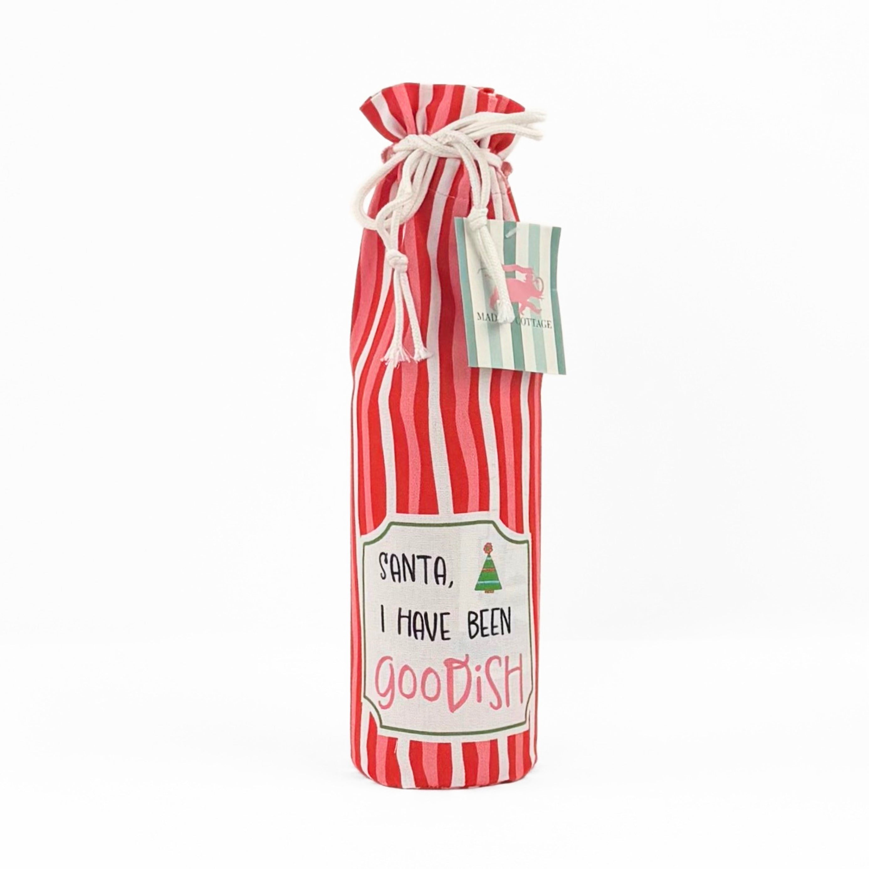 red and white striped wine bag with a “Santa, I have been goodish” label on the front