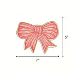 hand-painted tole tray featuring a delicate pink bow with white stripes and elegant gold trim showing 7" by 5" on a plain white background.