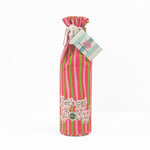 pink and green striped wine bag with “Let’s get jolly!” printed on the front